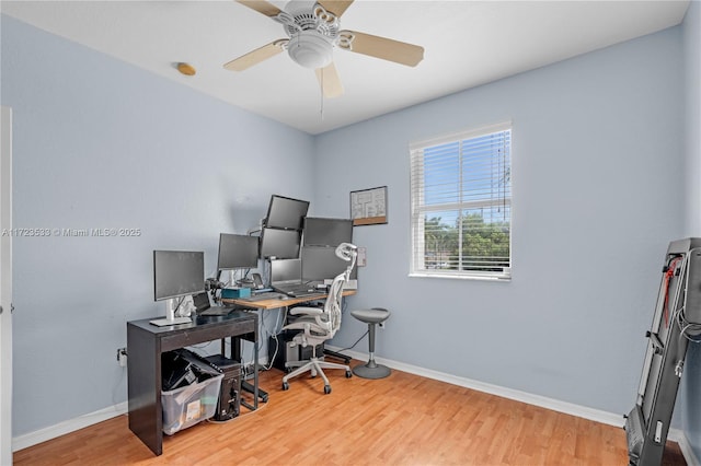 office with hardwood / wood-style floors and ceiling fan