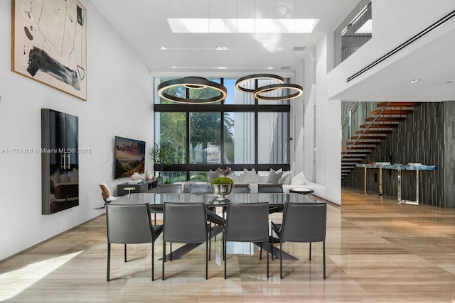 dining area featuring a high ceiling