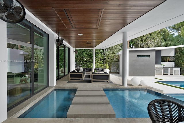 view of swimming pool with ceiling fan, area for grilling, an outdoor hangout area, and a patio area