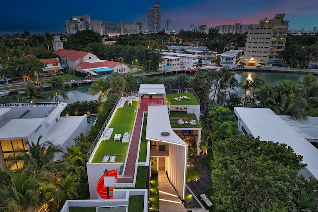 aerial view at dusk with a water view