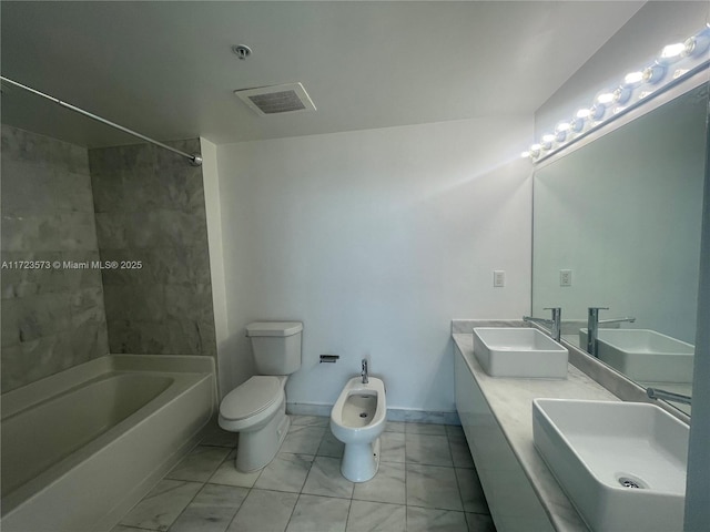 full bathroom with tiled shower / bath, vanity, a bidet, and toilet