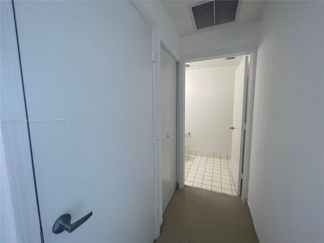 corridor featuring tile patterned floors