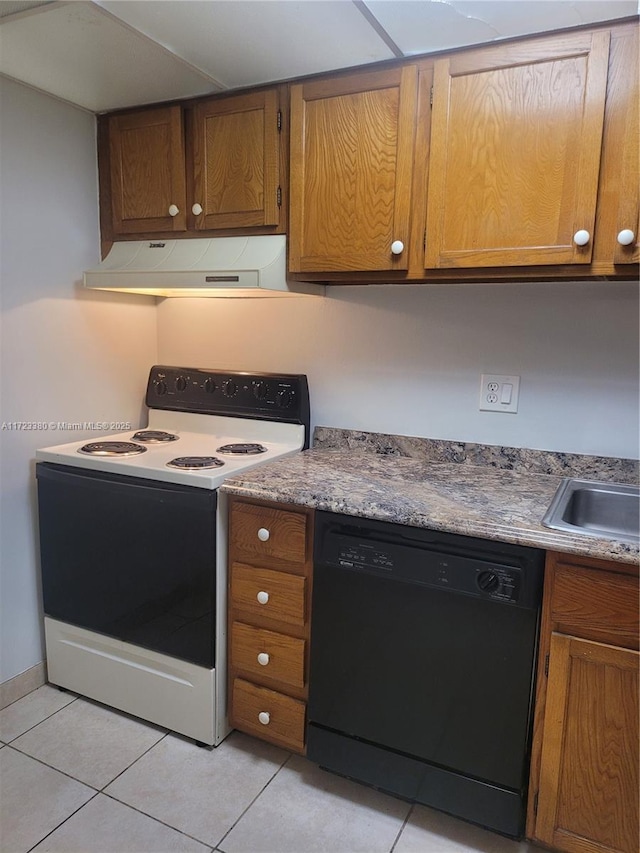 kitchen featuring electric range, light tile patterned floors, and black dishwasher