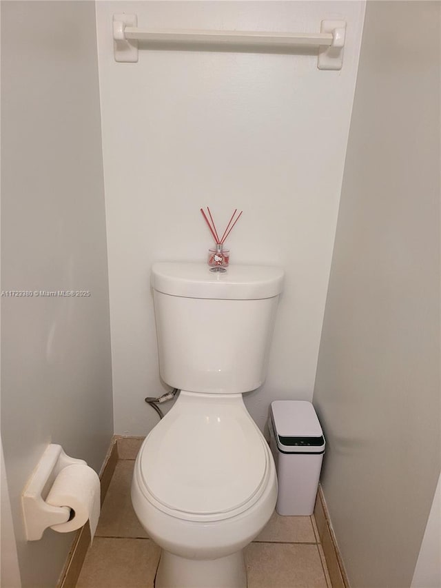 bathroom with tile patterned floors and toilet