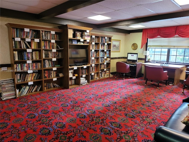 office space with a paneled ceiling