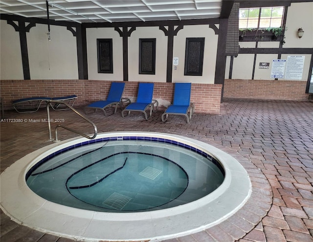 view of pool featuring an indoor in ground hot tub