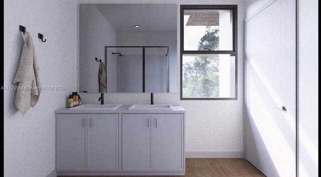 bathroom featuring a shower, hardwood / wood-style floors, and vanity