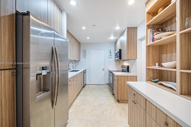 kitchen featuring appliances with stainless steel finishes and sink