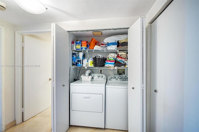 laundry room featuring washing machine and clothes dryer