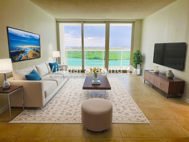 tiled living room with a wall of windows, a healthy amount of sunlight, and a textured ceiling