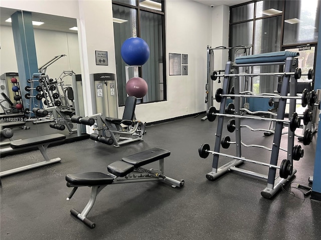 exercise room with baseboards