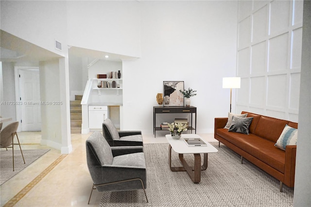 living room with a towering ceiling