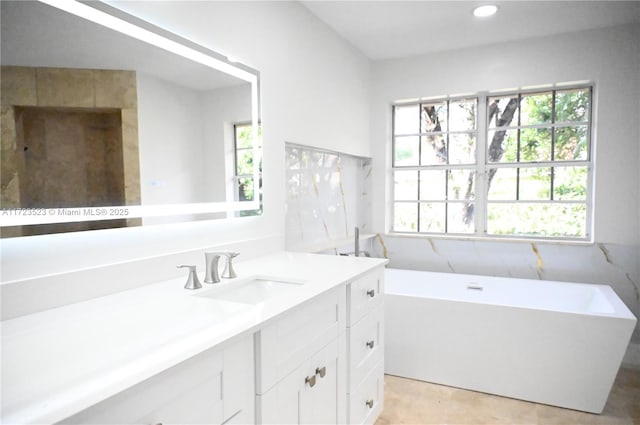 bathroom featuring vanity and a bathtub