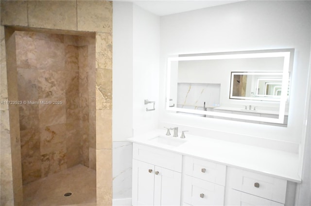 bathroom with a shower and vanity