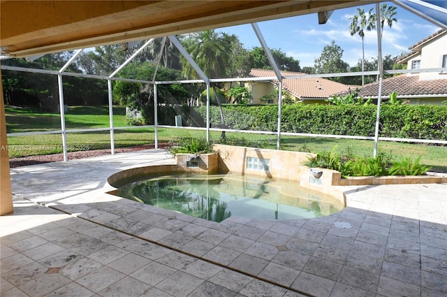 view of swimming pool featuring a lawn, a patio area, a jacuzzi, and glass enclosure