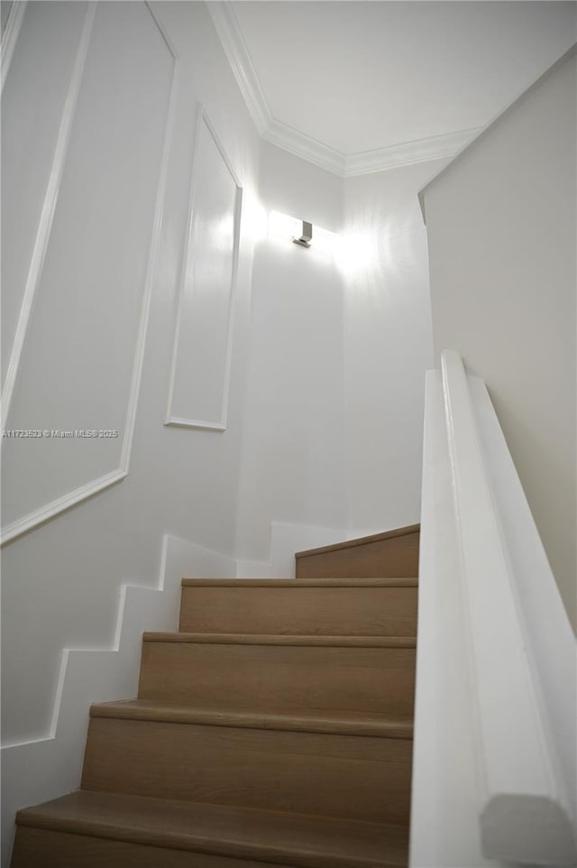 stairs featuring ornamental molding