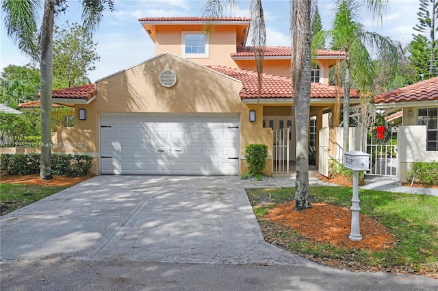 mediterranean / spanish house featuring a garage