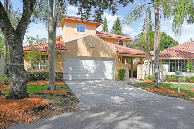 mediterranean / spanish house with a garage