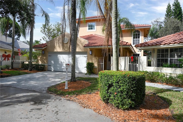 mediterranean / spanish-style home with a garage