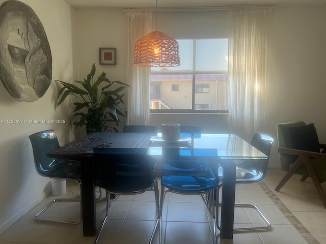 dining area with light tile patterned flooring