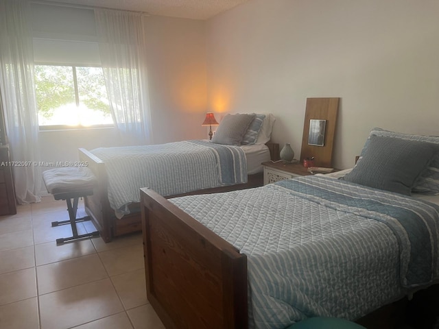 bedroom featuring light tile patterned floors