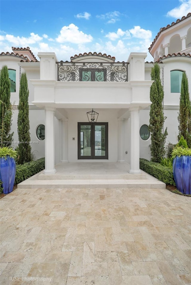 doorway to property with french doors and a balcony