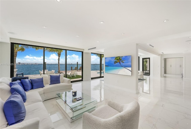 living room featuring plenty of natural light and expansive windows