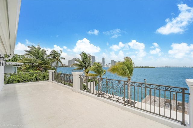 view of patio / terrace featuring a balcony and a water view