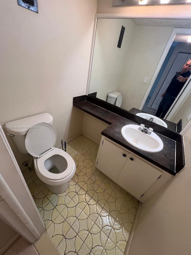 bathroom featuring vanity and toilet