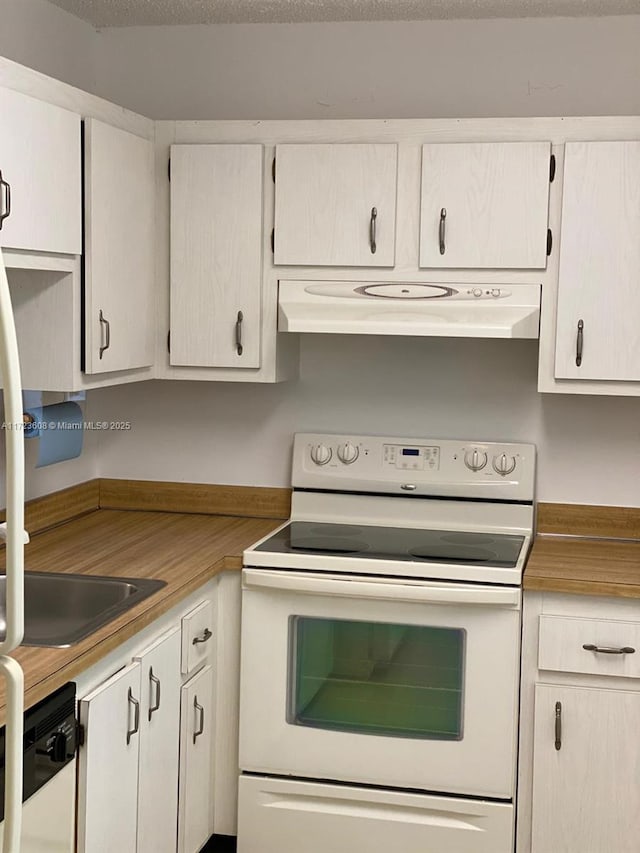 kitchen with white cabinets, white appliances, and sink