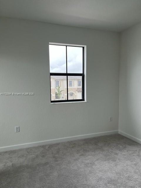 unfurnished room featuring carpet floors