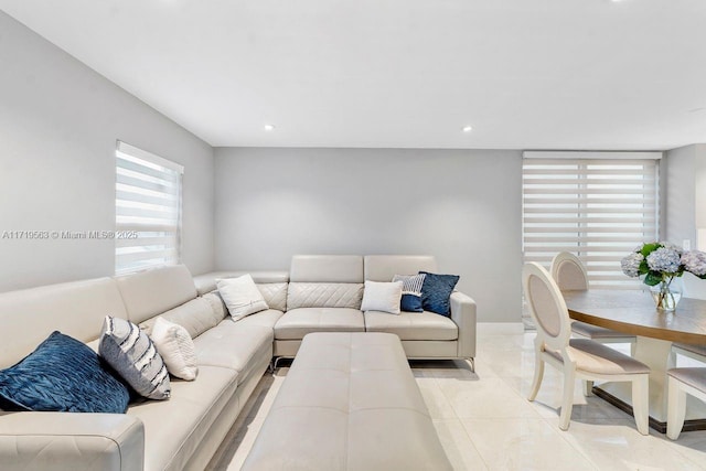 living room with light tile patterned floors