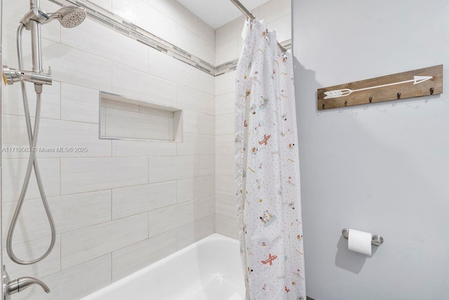 bathroom featuring shower / bathtub combination with curtain