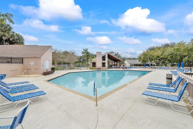 view of swimming pool with a patio