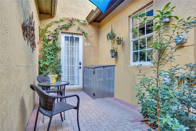 doorway to property featuring a patio area