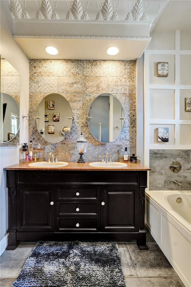 bathroom featuring a bath and vanity