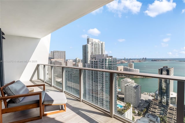 balcony featuring a water view