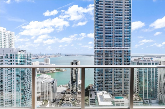 balcony featuring a water view