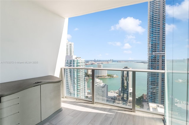 balcony featuring a water view