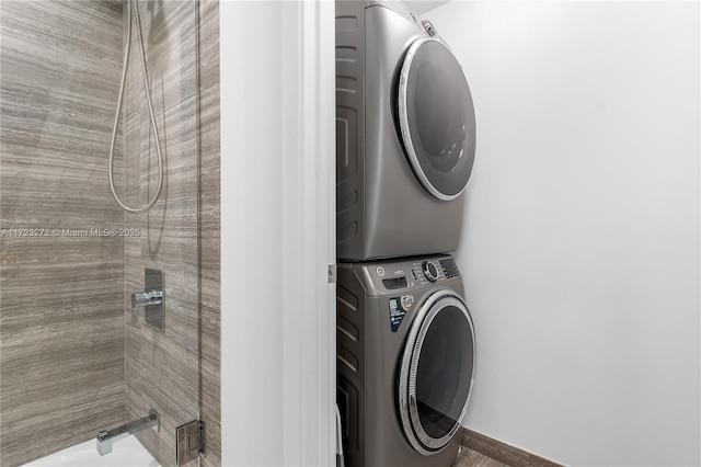 washroom featuring stacked washer and dryer