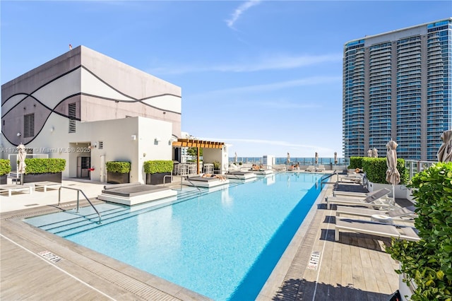 view of swimming pool featuring a patio area