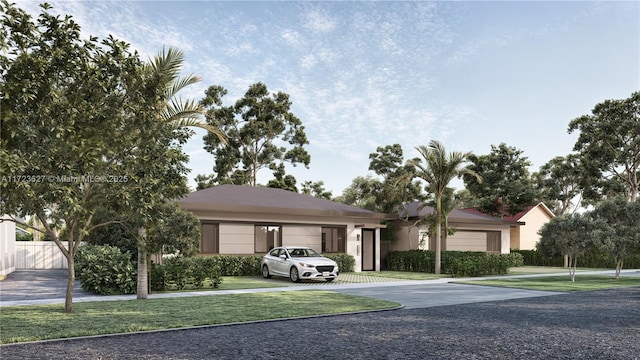 ranch-style house featuring a garage and a front lawn