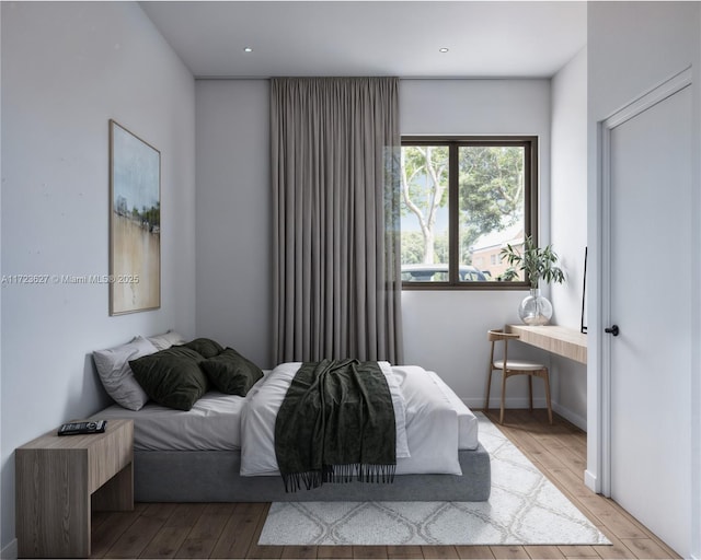 bedroom with light hardwood / wood-style floors