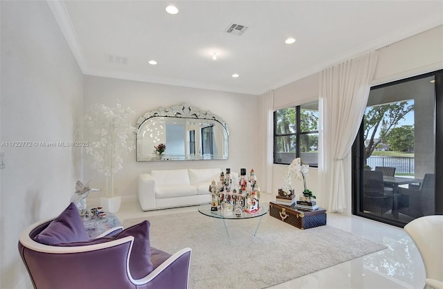 living room featuring crown molding