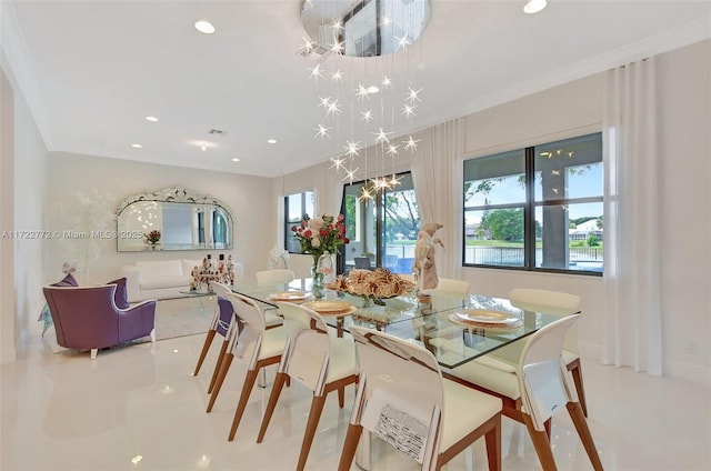 dining space with ornamental molding