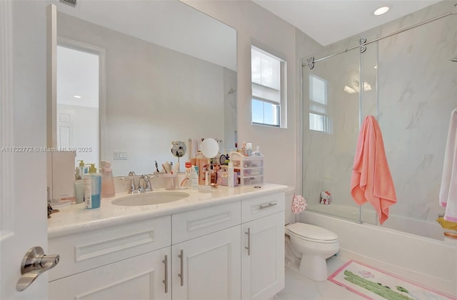 full bathroom with combined bath / shower with glass door, vanity, toilet, and tile patterned flooring