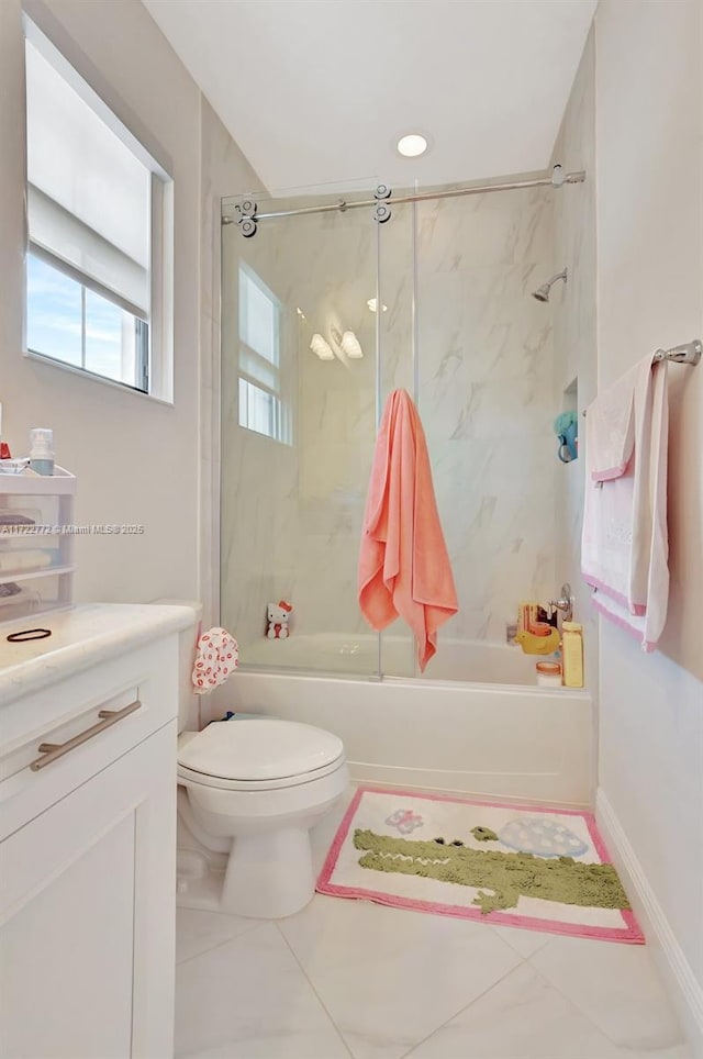 full bathroom with tile patterned floors, vanity, toilet, and tiled shower / bath