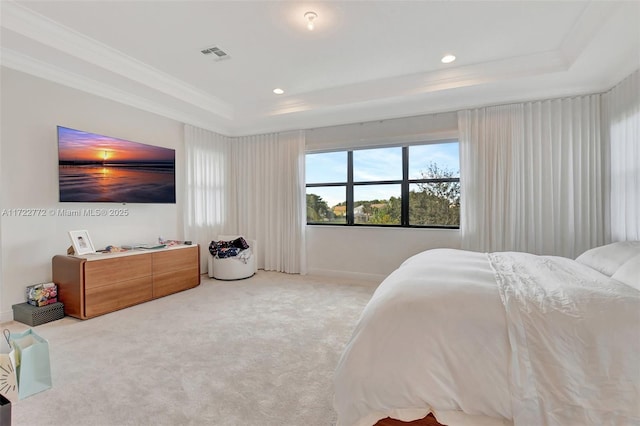 bedroom with a raised ceiling, light carpet, and crown molding