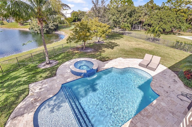 view of swimming pool with a patio area, a water view, a yard, and an in ground hot tub