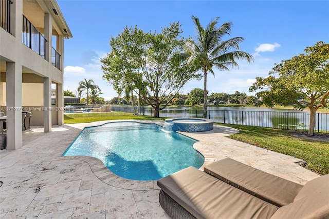 view of swimming pool with a patio area, a water view, and an in ground hot tub